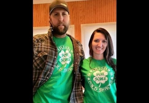 Derek Bieri with his wife Jessica wearing green shirt promoting Irish cold snack available on their store